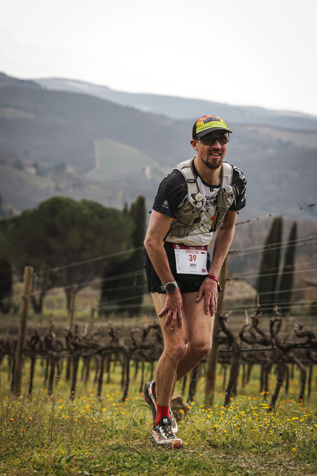 Jack Chamberlain running through a Tuscan vineyard at Chianti Ultra Trail.